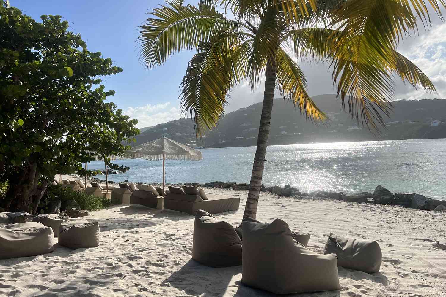 Private beach loungers at sunset